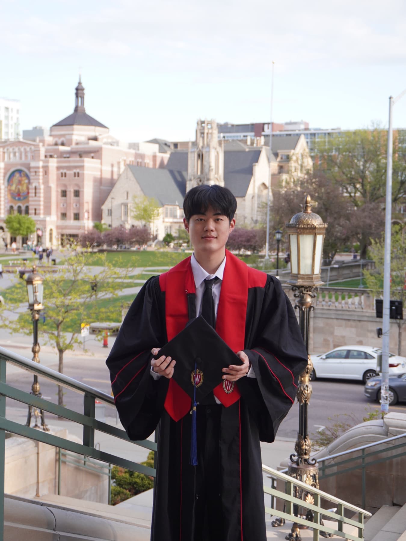 Yeongseok Lim in graduation regalia on the UW–Madison campus